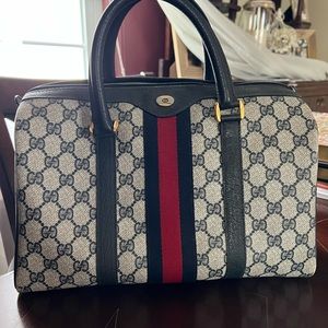 Guccis top handle bag